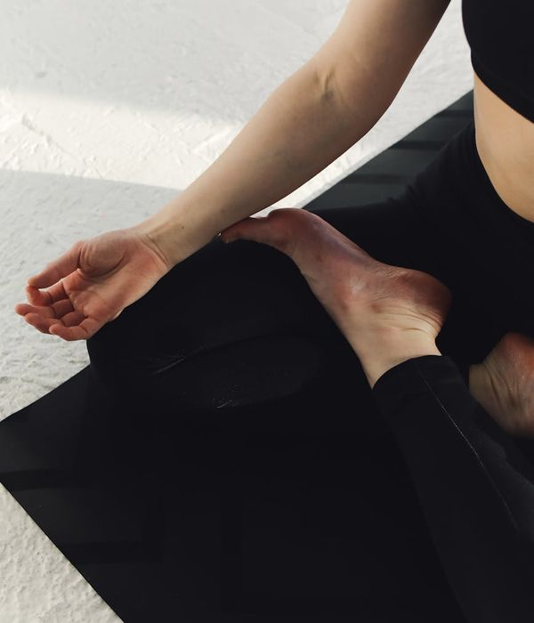 Woman in a calm yoga pose, embodying inner energy and peace.